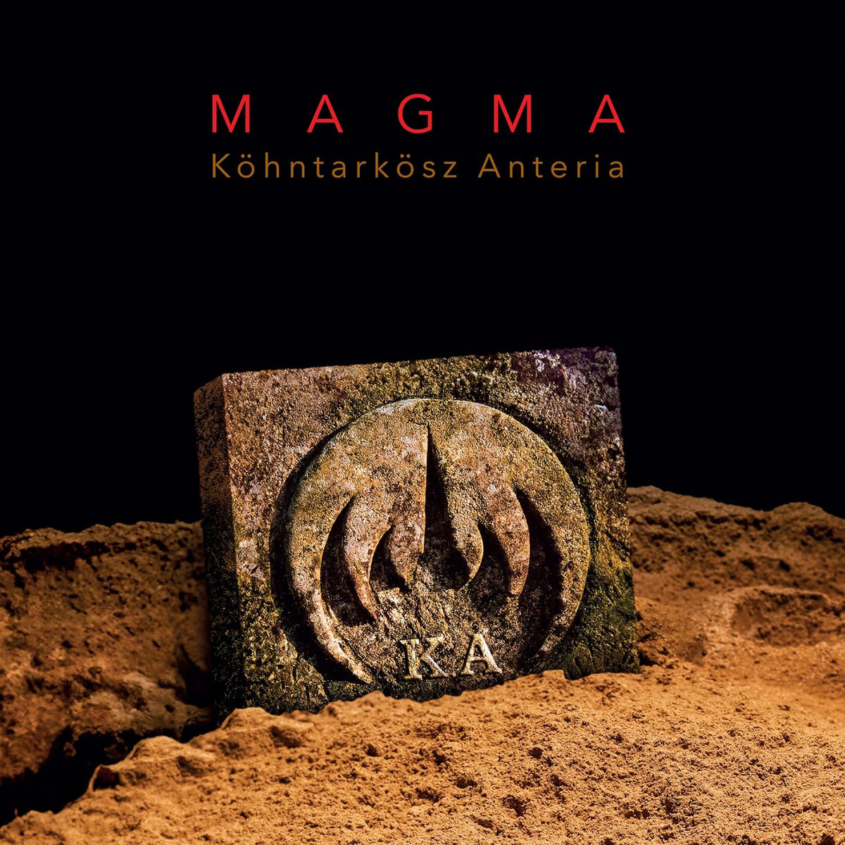 Magma album cover: stone block with carved spiral and “K.A” letters.
