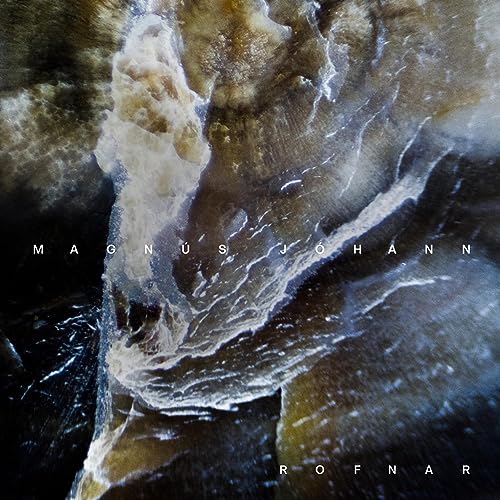 CD cover for Magnus Johann’s “Rofnar” featuring abstract, swirling brown and white textures.