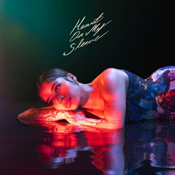 Mai,ella album cover: woman lying in water with red lighting.