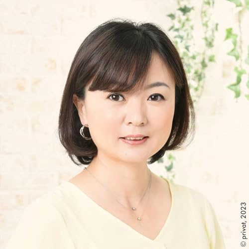 Portrait of a young Asian woman with short dark hair, smiling gently.