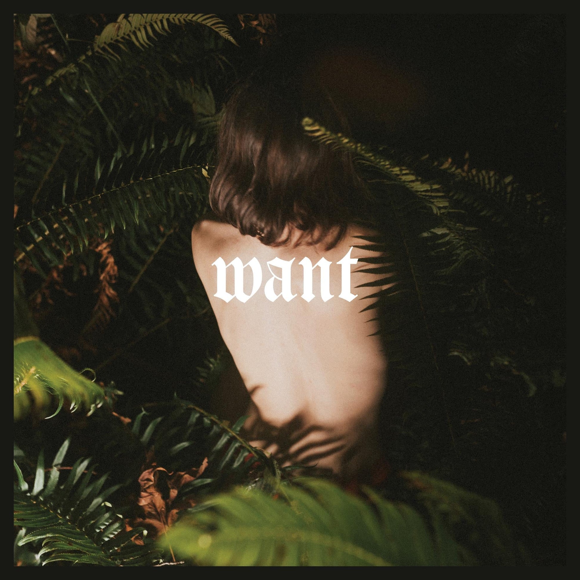 A person with their back turned is surrounded by ferns, with the word want overlaid.