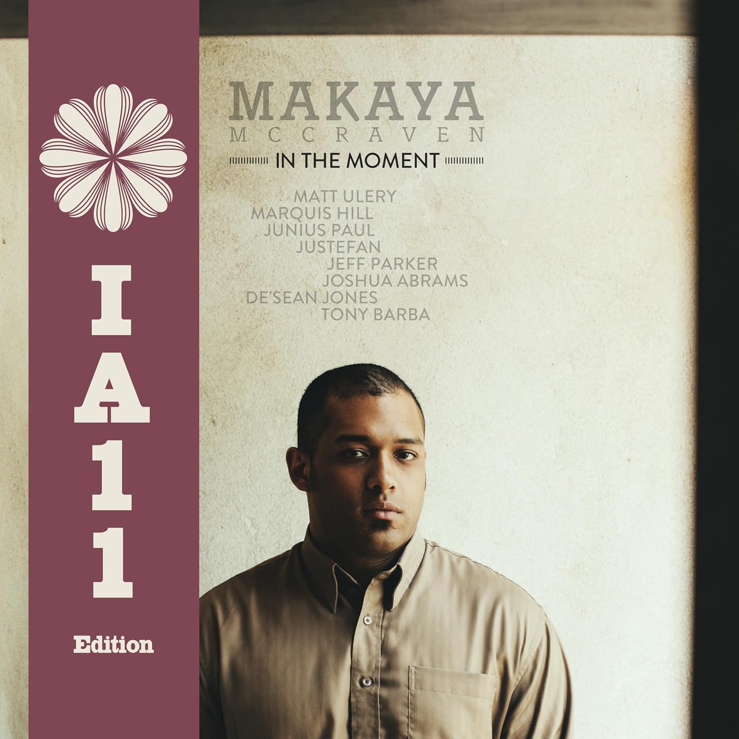 Vinyl album cover featuring Makaya McCraven’s portrait and floral design.