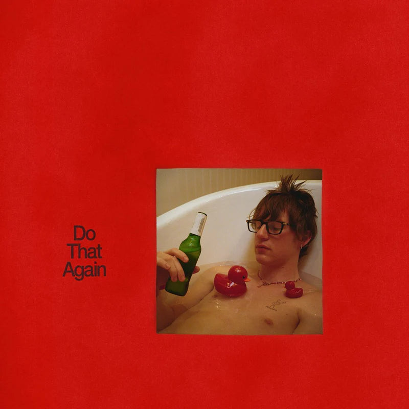 Red album cover featuring a person in a bathtub with a beer.