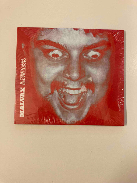 CD cover with distorted, frightening face against a red background.