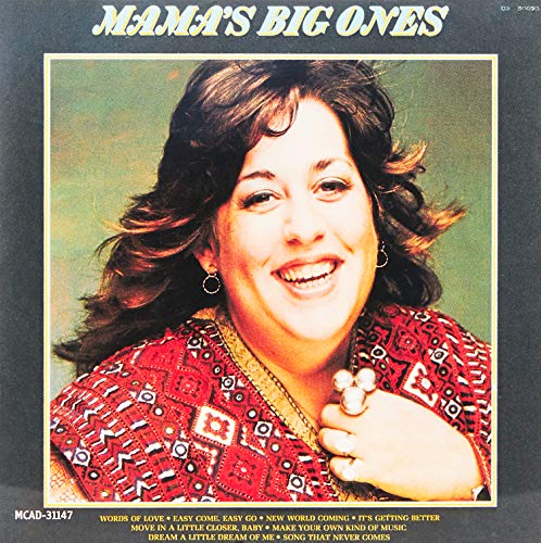 Mama Cass album cover: smiling woman with curly hair in a red patterned top.