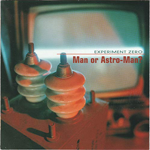 Album cover featuring two electrical insulators in front of a glowing television screen.