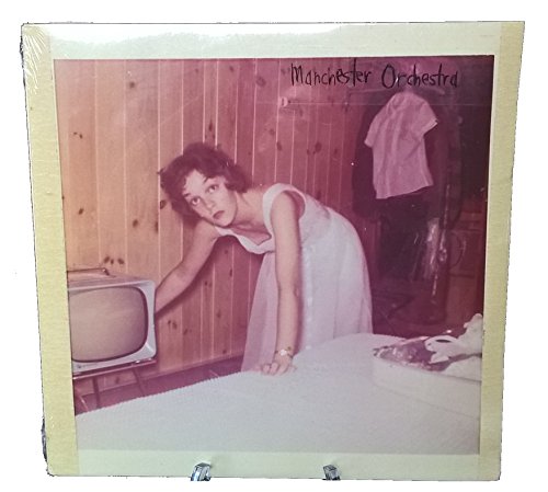 Vinyl record cover featuring a woman near a vintage television.
