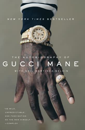 Book cover showing a hand wearing a gold watch and ring against grey background.