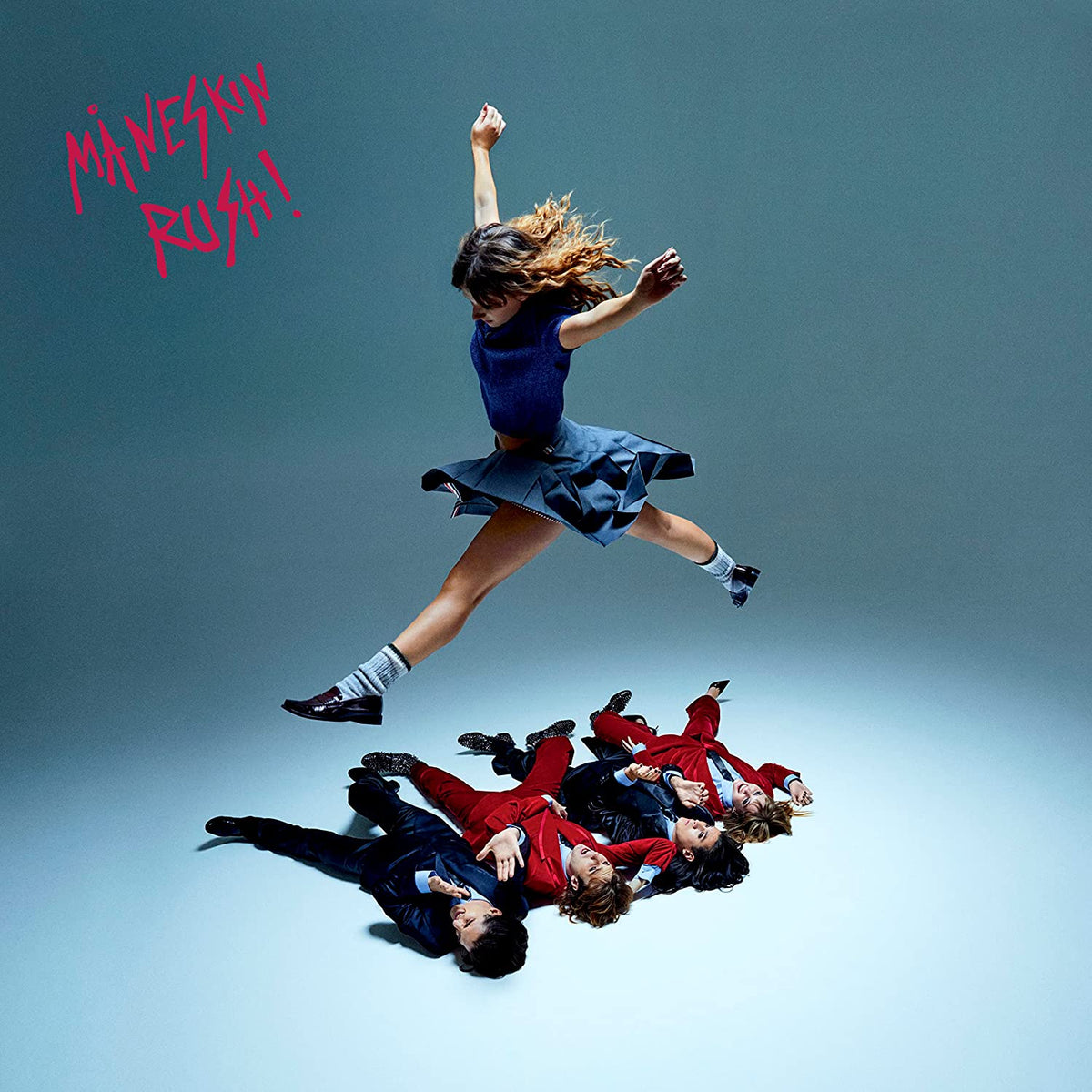 Måneskin “RUSH!” album cover: a dancer leaps over fallen figures.