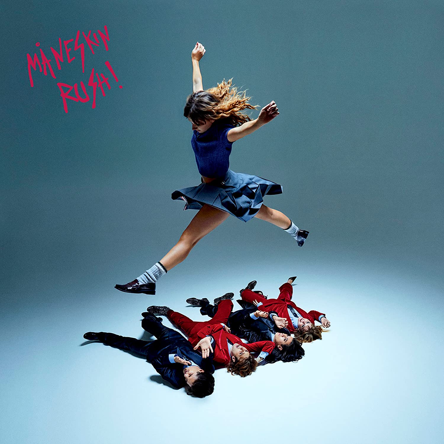 Måneskin “RUSH!” album cover: a dancer leaps over fallen figures.