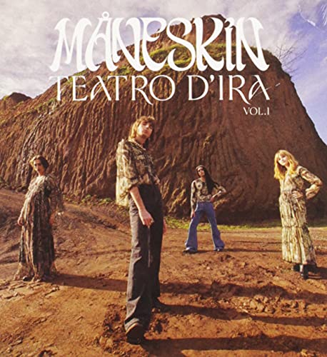 Måneskin band members standing in front of a large, rocky hill.