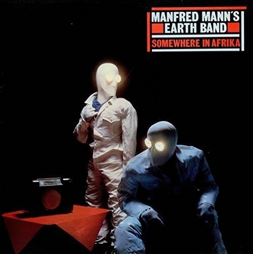 Vinyl album cover: two figures in suits with glowing mask-like heads.