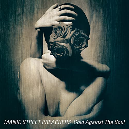 Album cover: person with roses obscuring face, dark and moody.