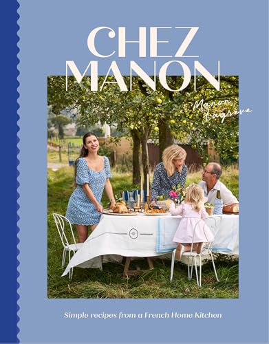 A family dines at an outdoor table in a garden on the cookbook cover.