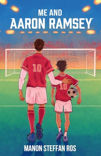 An adult and a child in red football kits walking on a pitch.