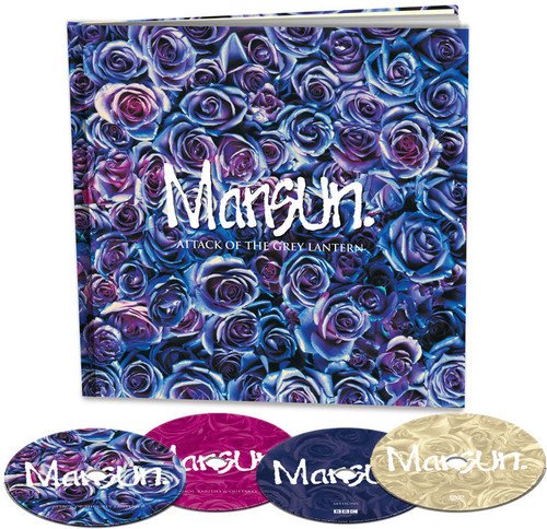 "Album cover with rose pattern and four CDs in different colors."