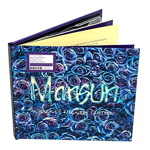 Mansun album “Attack Of The Grey Lantern” CD in floral-patterned case.