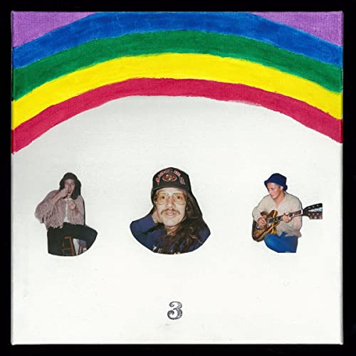 Album cover with a rainbow arch, three cutout photos of musicians, and the number 3.