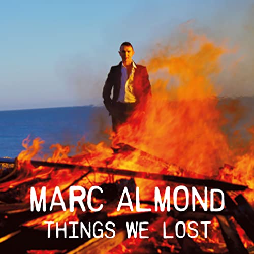 Marc Almond album cover with a man standing before flames and sea.