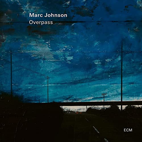CD cover for Marc Johnson’s “Overpass” with a blurred, blue landscape.