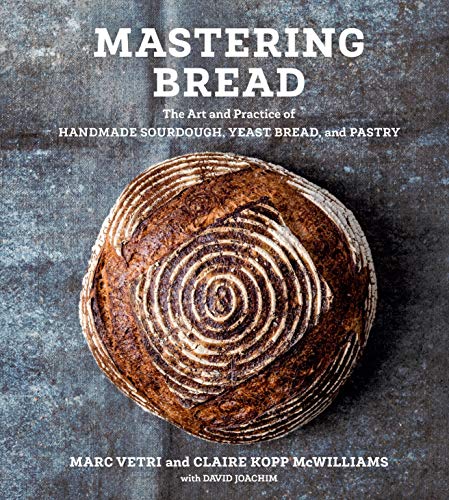 Book cover: “Mastering Bread” with a photo of a rustic sourdough loaf.