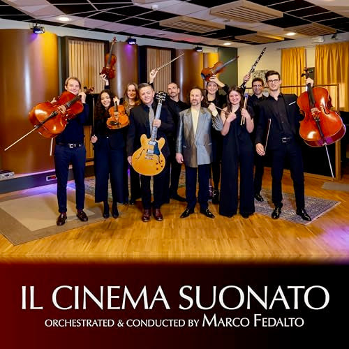 Orchestra with violins, guitars, and cello in a recording studio.