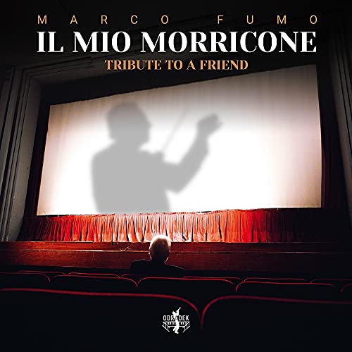 "Album cover with shadow of conductor on screen, red curtains, and empty theater seats."