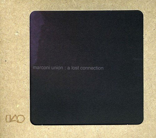 The image depicts a CD cover with a dark, cloudy background and white text. Alt text: Dark grey CD cover with "marconi union : a lost connection" in white text.