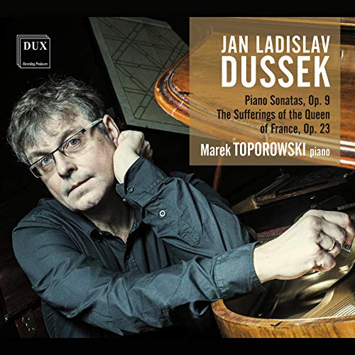 A man sitting at a piano with a CD cover overlay displaying text.