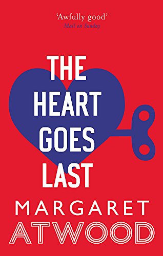Book cover: red background, blue heart with a key, white text.