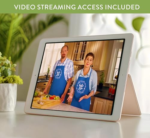 Tablet displaying a couple in aprons in a kitchen setting.
