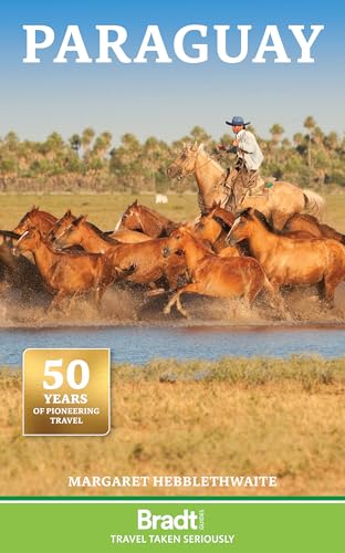 Book cover: Paraguayan gaucho on horseback with running horses in a field.
