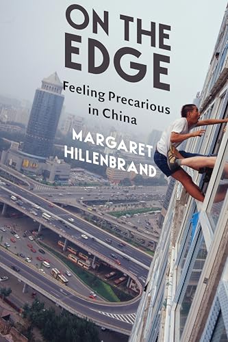 Book cover: man clinging to a skyscraper overlooking a Chinese city.