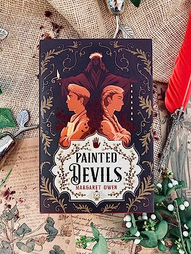 Book cover for "Painted Devils" featuring two figures and ornate design.