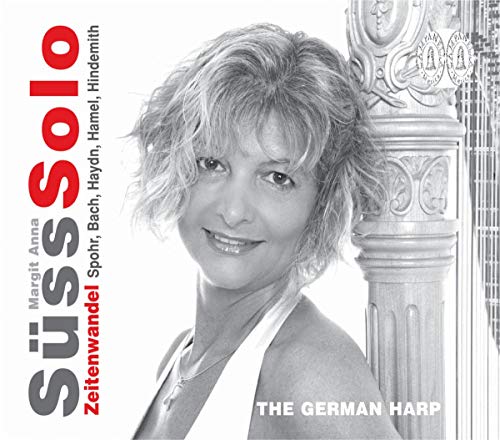Black and white CD cover featuring a smiling woman with curly hair.