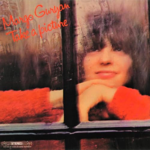 Album cover showing Margo Guryan in a red sweater looking through a window pane.