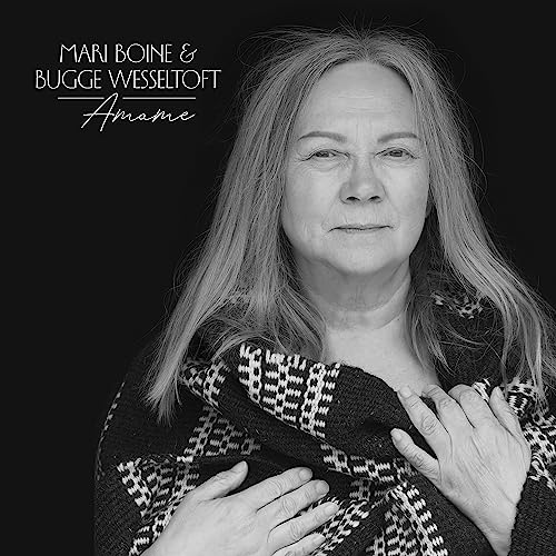 Black and white portrait of Mari Boine, album cover for "Amame".