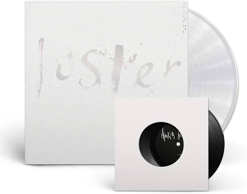 Clear vinyl record and black 7-inch single with white sleeves.