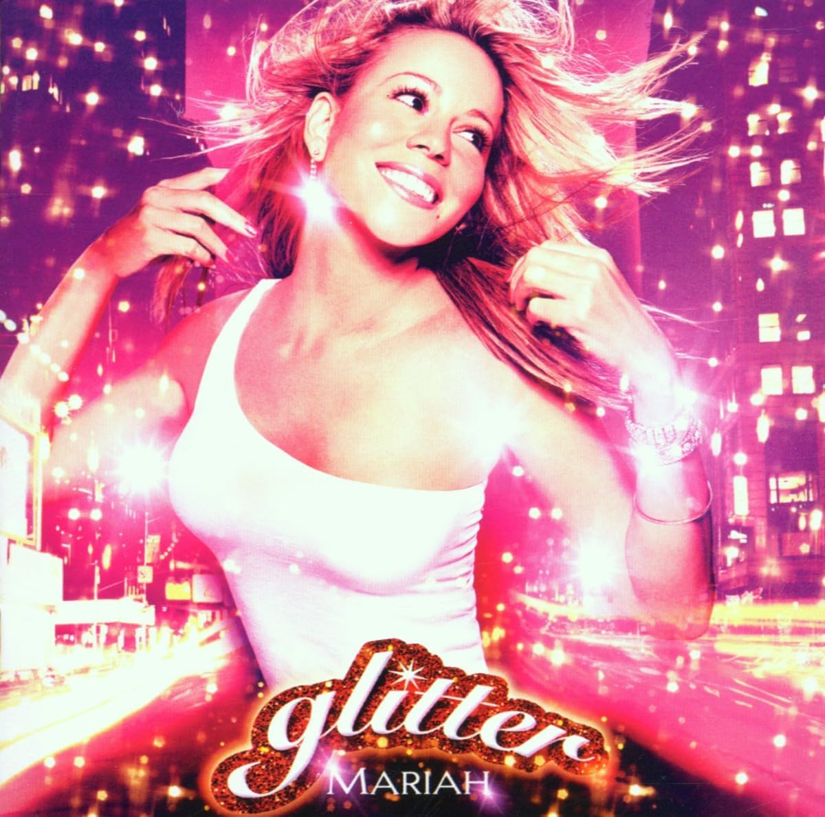 Mariah Carey album cover, "Glitter", with sparkling lights and city backdrop.