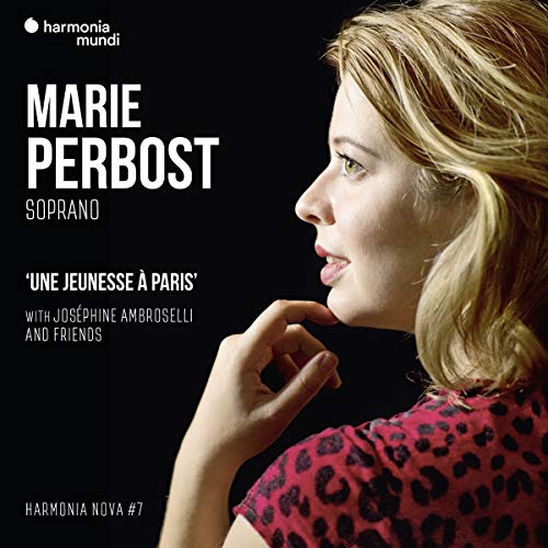 A woman with blonde hair, wearing a red leopard print top, against a black background.