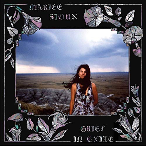 Album cover: woman in field framed by iridescent floral designs.