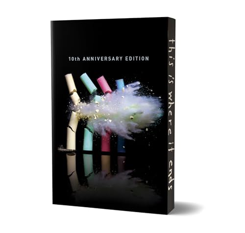Black book cover with broken crayons and a burst of color.