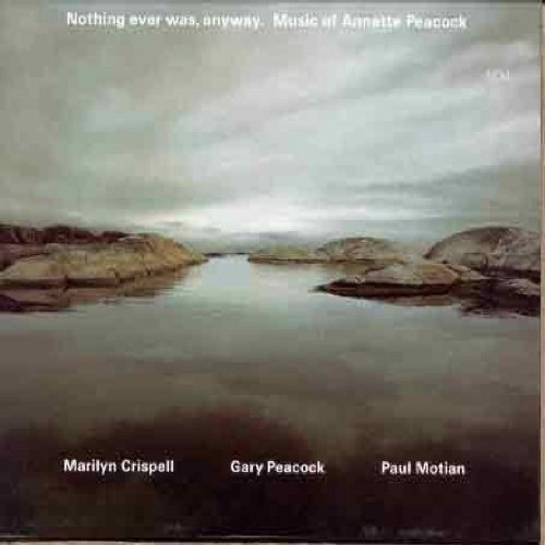 "CD album cover with serene rocky shoreline and cloudy sky, featuring artist names."