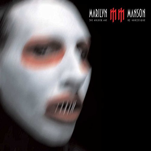 Blurred face of Marilyn Manson with white makeup and red eyeshadow on black background.