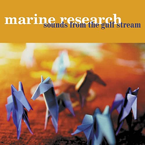 Vinyl record cover with origami whales against an orange and blue background.