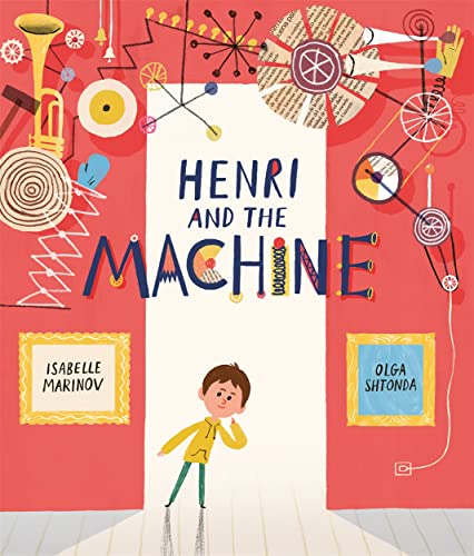 A boy in a yellow hoodie stands before a red wall with mechanical illustrations.