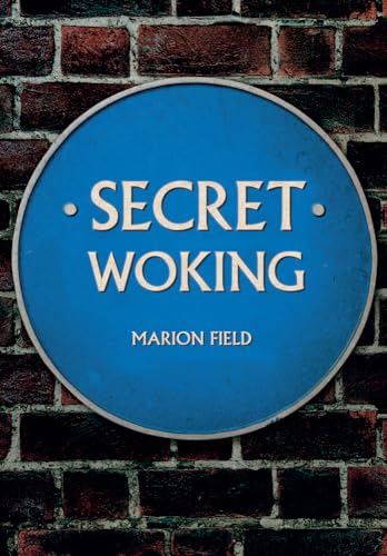 Blue plaque reading "Secret Woking" by Marion Field against brick wall.