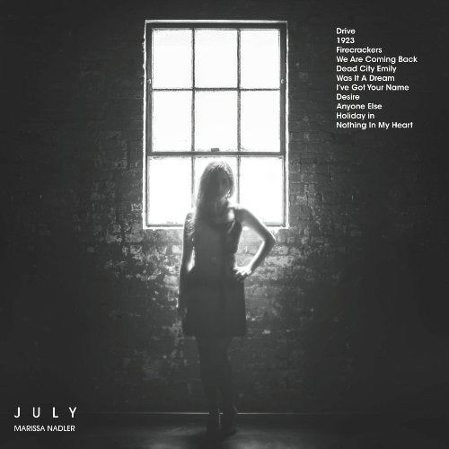Black and white album cover featuring a woman standing before a window.