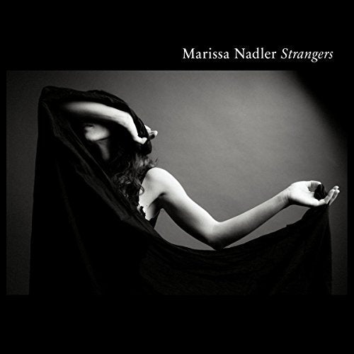 Black and white album cover featuring a woman draped in fabric.