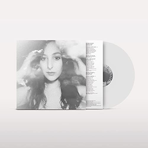 Black and white album cover with a woman’s face and opaque white vinyl record.